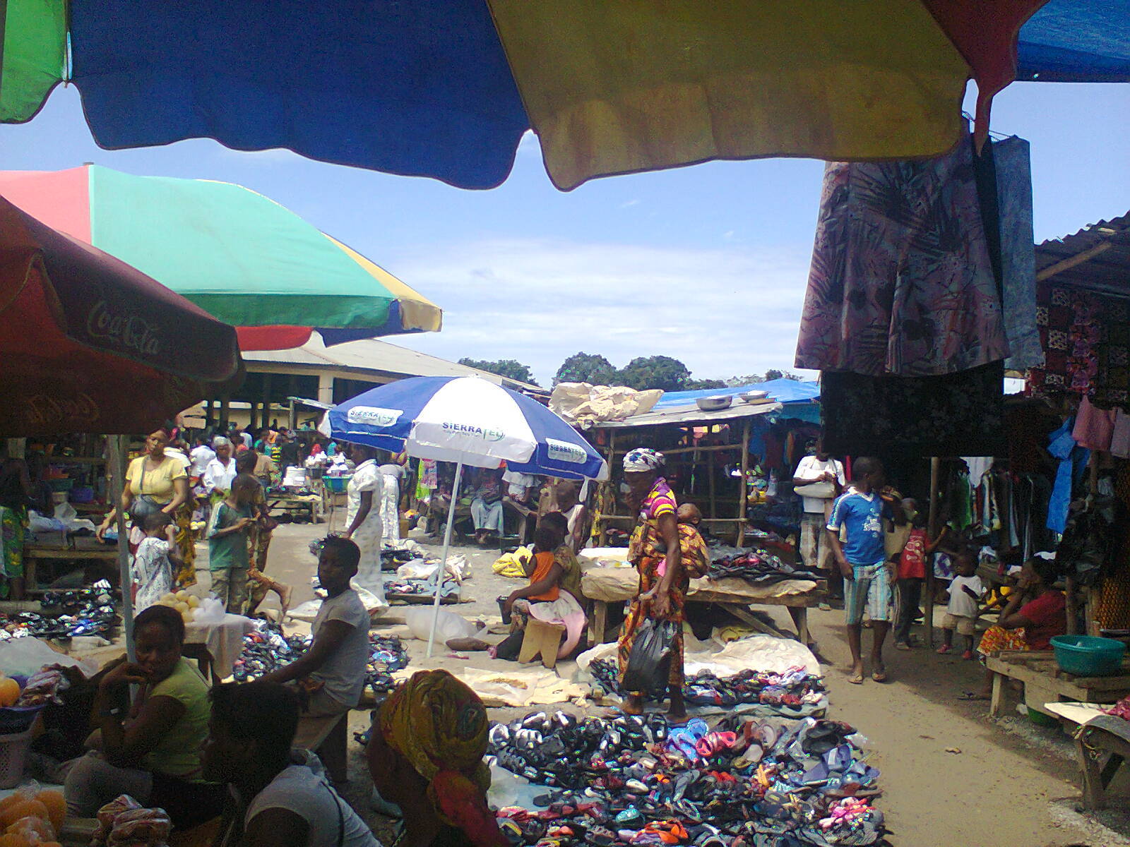 Children selling for their parents at the market in Kono